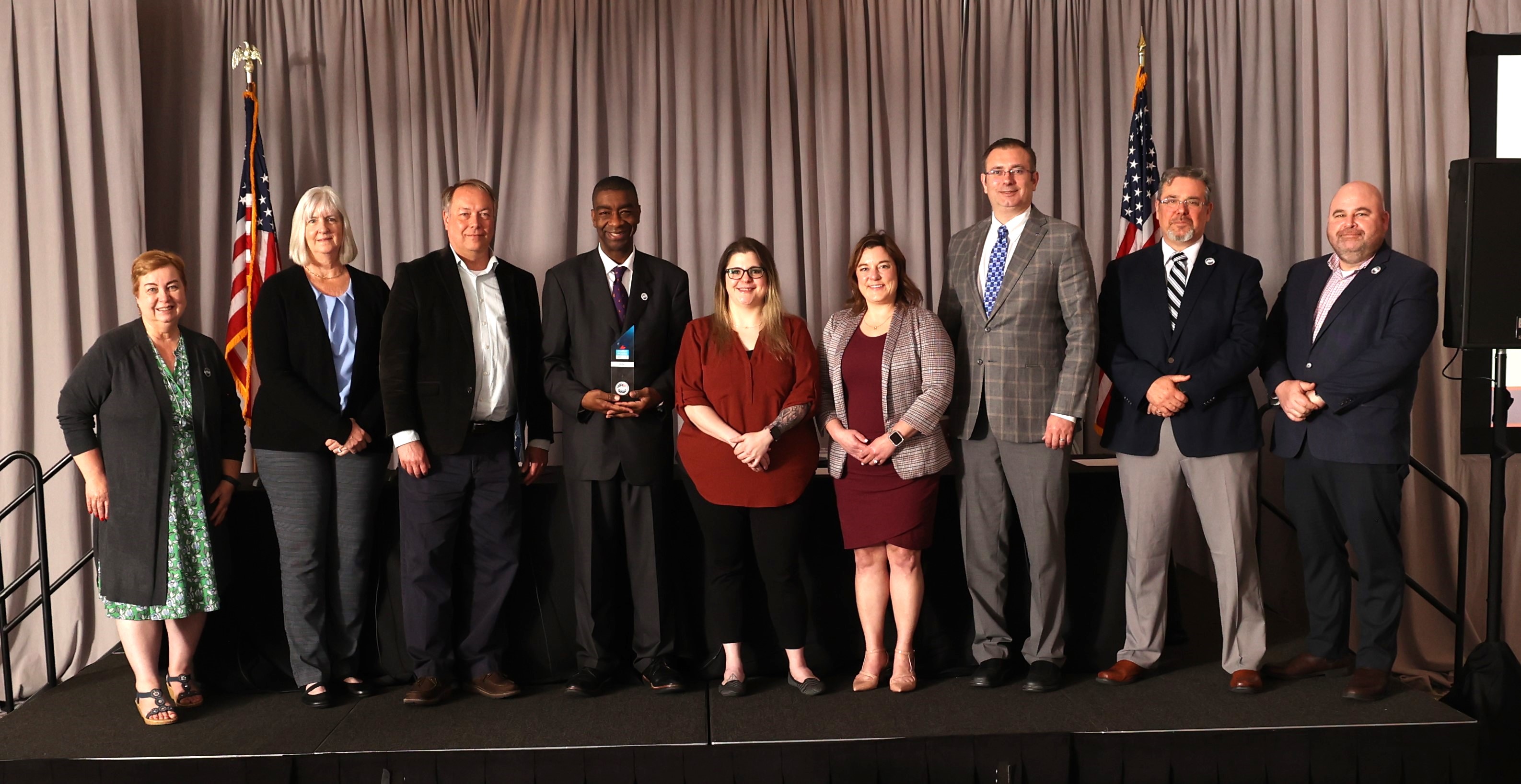The EAC Commissioners present a Clearie Award to winners at the Local Leadership Council Annual Meeting.