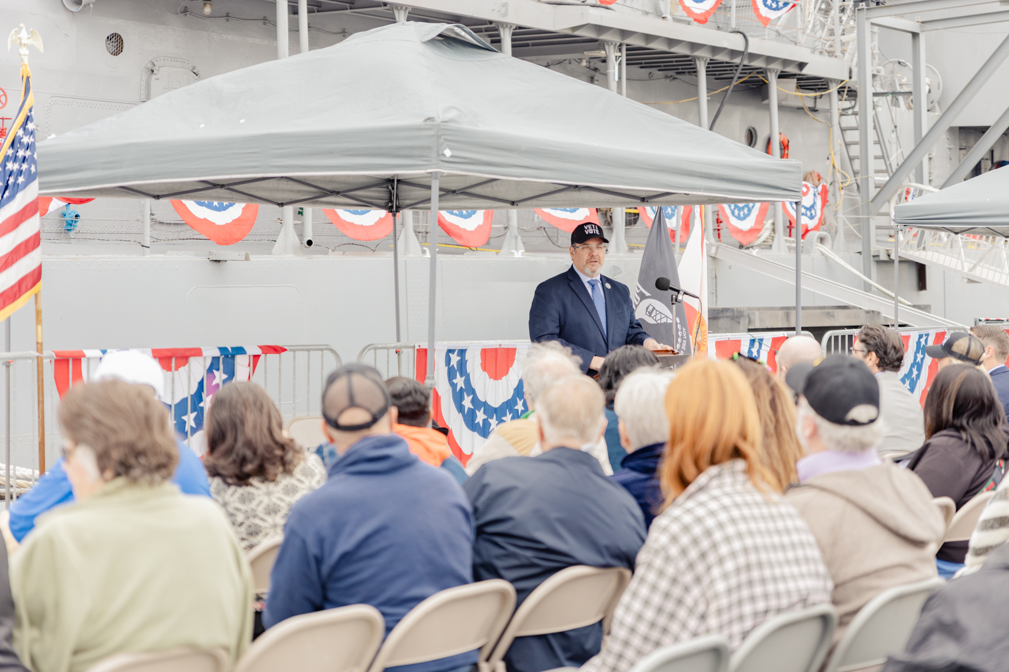Chairman Palmer speaking on the USS Orleck.