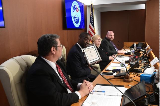 Chairman Thomas Hicks presents a certificate to The Election Center’s Executive Director Tim Mattice to commemorate his 30-year career in election administration.  