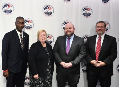 Photograph of U.S. EAC Commissioners, from left to right: Commissioner Thomas Hicks, Chairwoman Christy McCormick, Vice Chair Benjamin Hovland, and Commissioner Donald Palmer