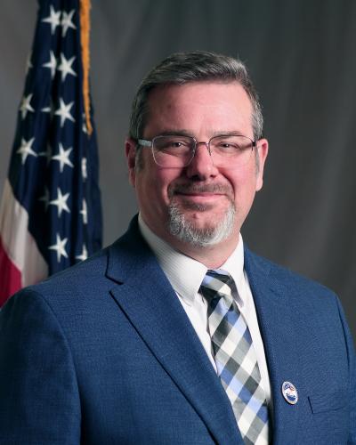 Headshot of Commissioner Palmer