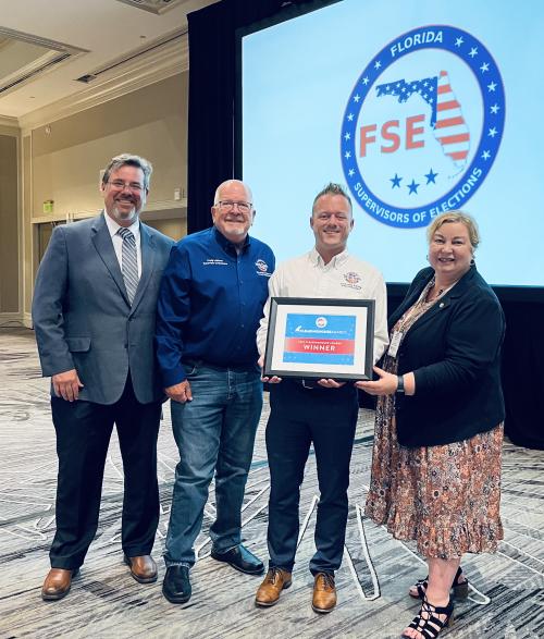 EAC Commissioner Donald Palmer and Commissioner Christy McCormick present a 2023 Clearinghouse Award to the Hillsborough County Florida Supervisor of Elections in Florida.